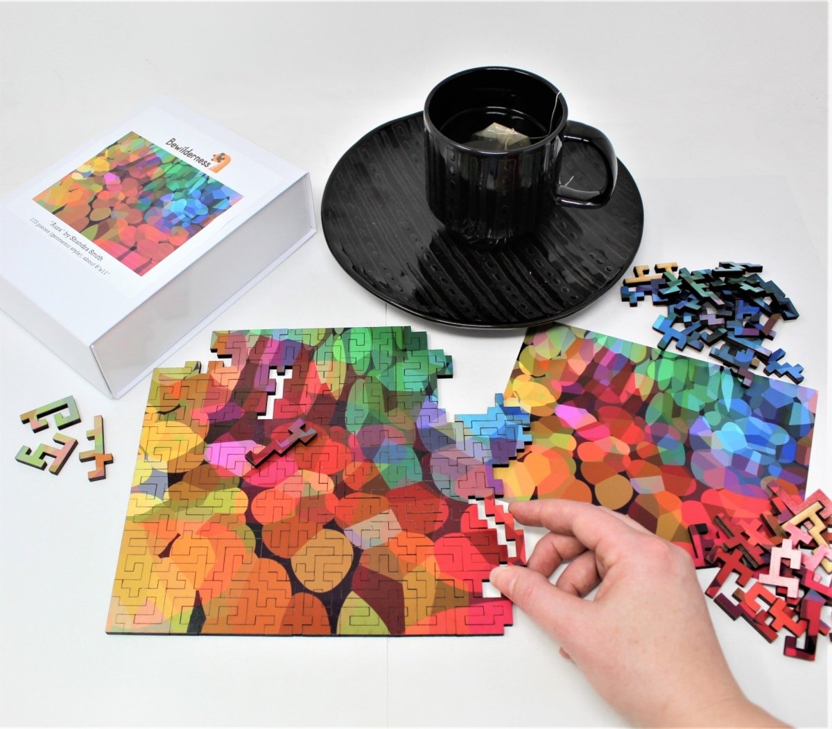 Ahnna putting together our Aura colorful geometric puzzle