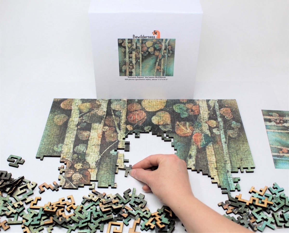 Autumn Aspen by Laura McElfresh, geometric wooden puzzle by Bewilderness being put together