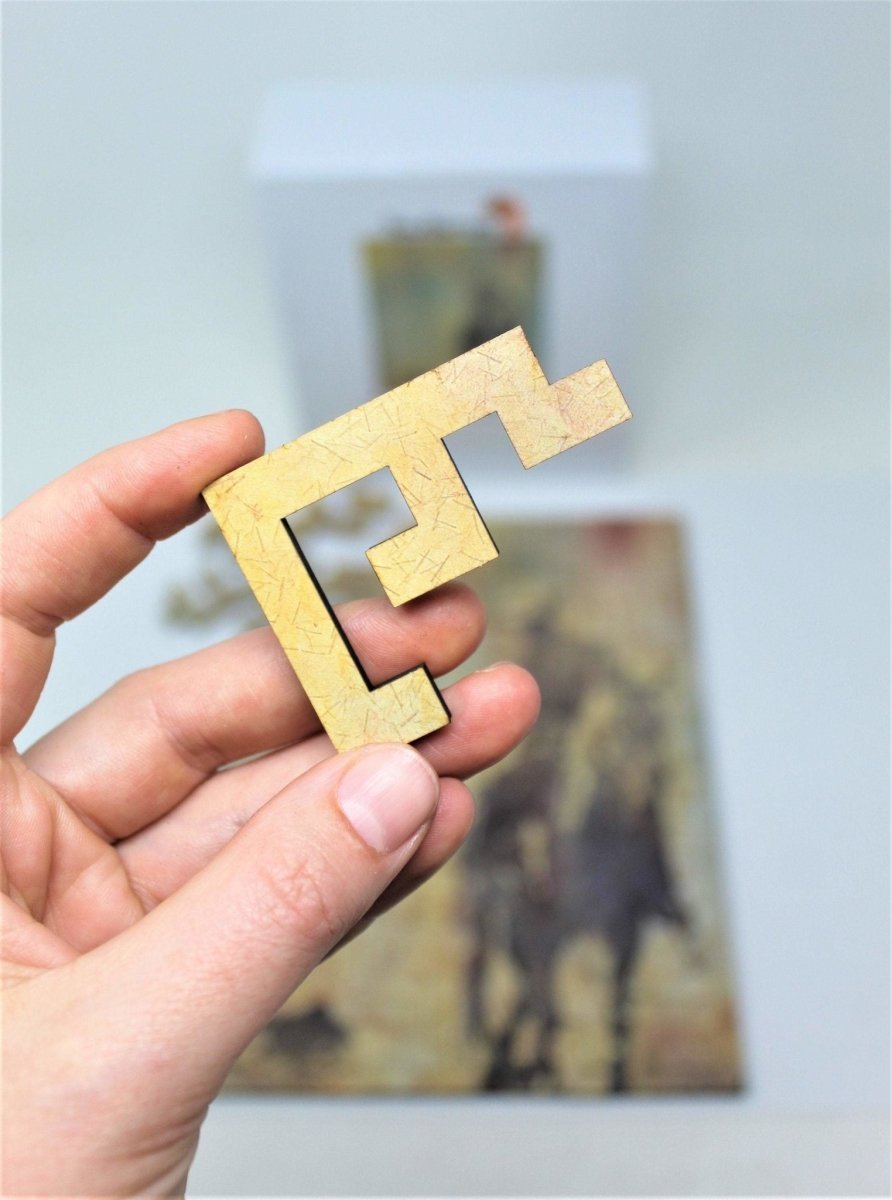 Single piece close-up, Backward Glance cowboy puzzle by Laura McElfresh