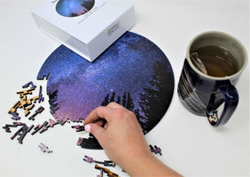 Ahnna putting together Milky Way at Night circular geometric puzzle